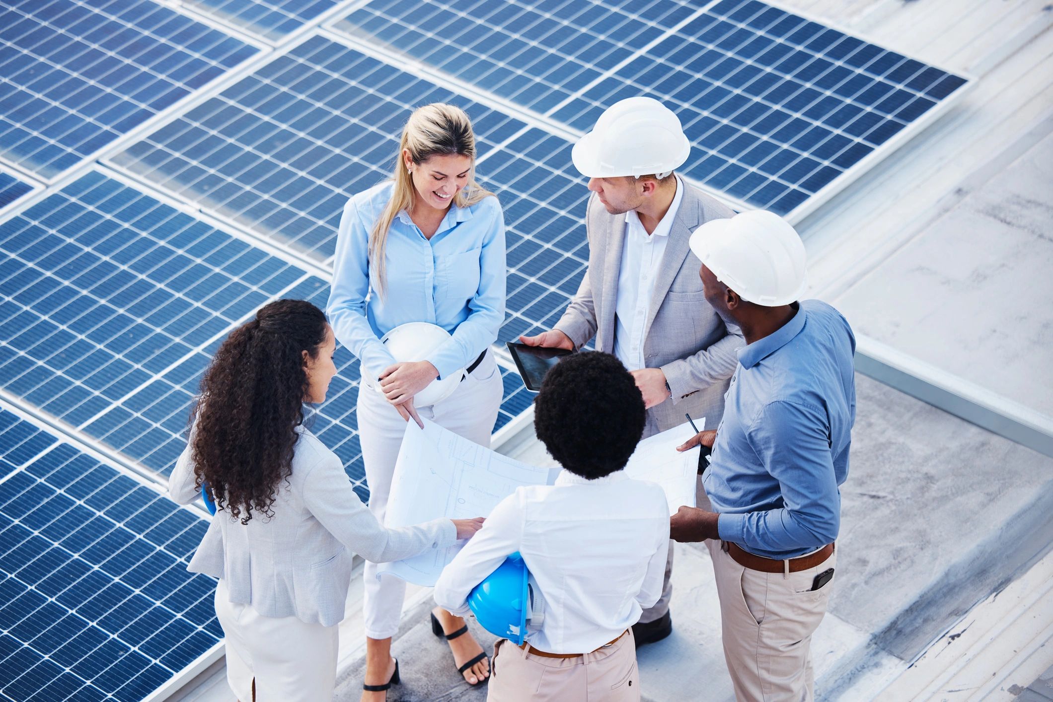 solar energy professionals team rooftop panels