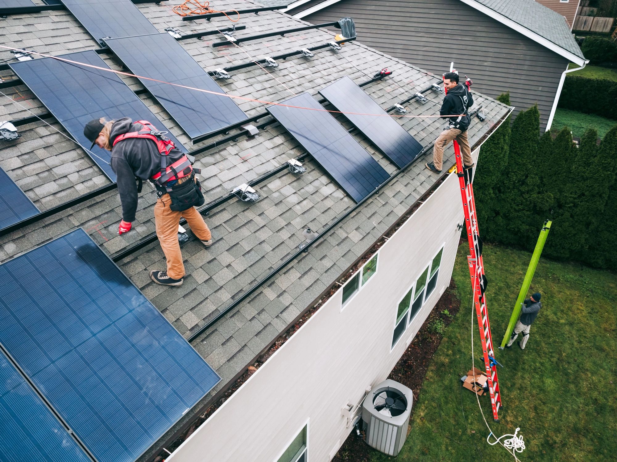 solar energy professionals team rooftop panels