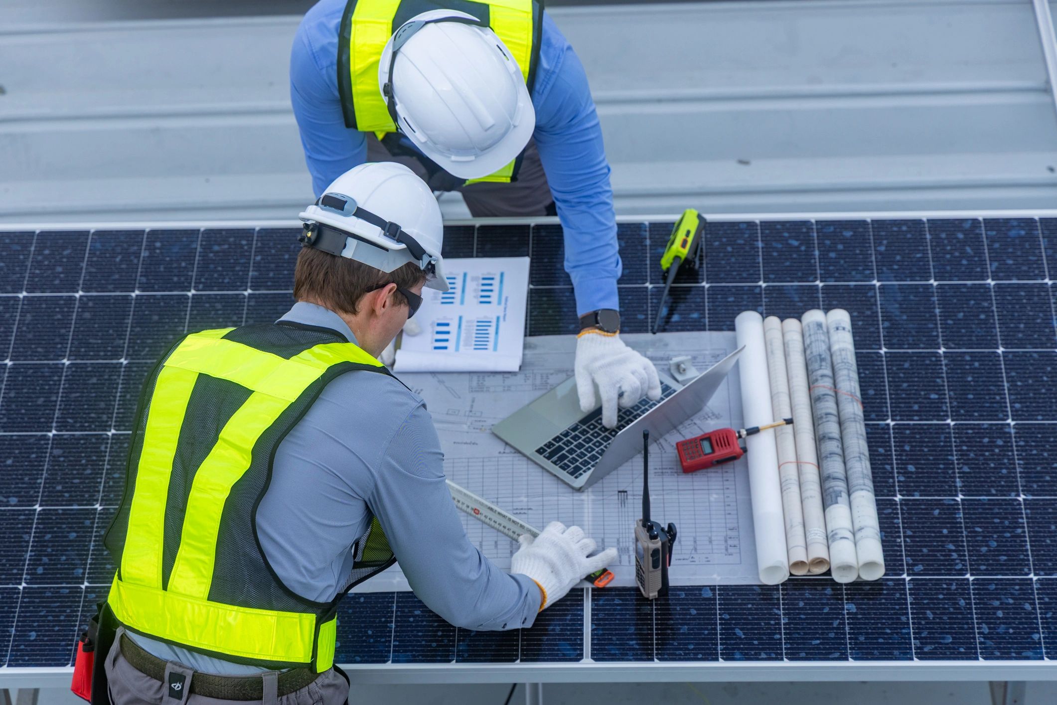 solar team reviewing project on site